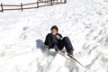 Child falls from skiing in winter Royalty Free Stock Photo