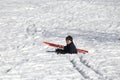 Child falls from skiing in winter Royalty Free Stock Photo