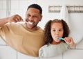 Child, father and brushing teeth in a family home bathroom for dental health. Face of happy african man and girl kid Royalty Free Stock Photo