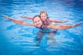 Child and father playing in swimming pool Royalty Free Stock Photo