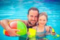 Child and father playing in swimming pool Royalty Free Stock Photo