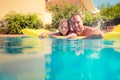 Child and father playing in swimming pool Royalty Free Stock Photo