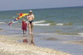 Child and father at the sea side