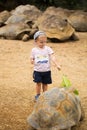 Child feeding Aldabra giant tortoise. Mauritius island Royalty Free Stock Photo