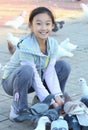 Child feeding pigeon Royalty Free Stock Photo