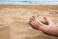 Child feet in the sand on a beach. Royalty Free Stock Photo