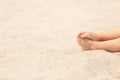 Child feet in sand at summer beach Royalty Free Stock Photo