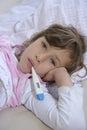 Child with fever in bed Royalty Free Stock Photo