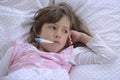 Child with fever in bed Royalty Free Stock Photo