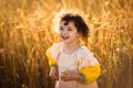 Child in a field of wheat