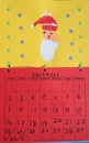 Child finger paint drawing of Santa and December calendar at Christmas Royalty Free Stock Photo