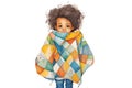 child with finished quilt draped over shoulders