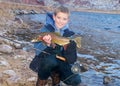 Child fishing - holding a trophy trout Royalty Free Stock Photo