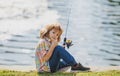Child fishing at river. Young kid fisher. Summer outdoor leisure activity. Little boy angling at river bank with rod. Royalty Free Stock Photo
