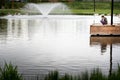 Child fishing at a stocked rainbow trout pond Royalty Free Stock Photo