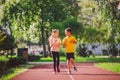 Child fitness, twins kids running on stadium track in city park , training and children sport healthy lifestyle. Outdoor Royalty Free Stock Photo