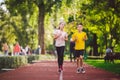 Child fitness, twins kids running on stadium track in city park , training and children sport healthy lifestyle. Outdoor Royalty Free Stock Photo