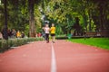 Child fitness, twins kids running on stadium track in city park , training and children sport healthy lifestyle. Outdoor Royalty Free Stock Photo