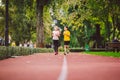 Child fitness, twins kids running on stadium track in city park , training and children sport healthy lifestyle. Outdoor Royalty Free Stock Photo