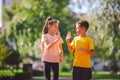 Child fitness, twins kids running on stadium track in city park , training and children sport healthy lifestyle. Outdoor Royalty Free Stock Photo