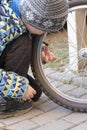 Child fixing bike or bicycle