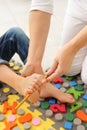 Child flatfoot treatment using special massage carpet.Little girl on massage mat doing exercises for flatfoot prevention