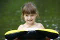 Child floating on a inner tube Royalty Free Stock Photo