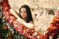 Child at a flower fair. Little adorable girl stand near colorful flowers in spring garden Royalty Free Stock Photo