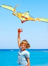 Kid flying kite outdoor. Royalty Free Stock Photo