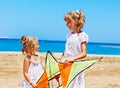 Kid flying kite outdoor. Royalty Free Stock Photo