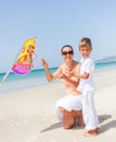 Child flying kite beach outdoor. Royalty Free Stock Photo