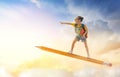 Child flying on a pencil Royalty Free Stock Photo