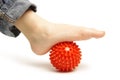 Child foot with plastic massage ball Royalty Free Stock Photo