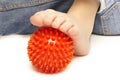 Child foot with plastic massage ball Royalty Free Stock Photo