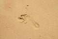 Child foot step on sand