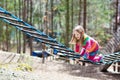 Child in adventure park. Kids climbing rope trail. Royalty Free Stock Photo