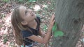 Child in Forest, Kid Playing in Nature, Girl in Adventure Outdoor Behind a Tree