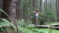 Child in Forest Walking on Tree Log, Kid Playing Hiking in Park, Tourist Adventure Girl in Camping in Mountains, Camp Trip