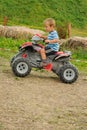 Child on four wheeler Royalty Free Stock Photo