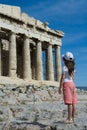 Child in front of Ancient Parthenon in Acropolis A Royalty Free Stock Photo