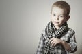 Child. funny little boy in scurf. Fashion Children. 4 years old. plaid shirt