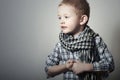 Child. funny little boy in scurf. Fashion Children. 4 years old. plaid shirt