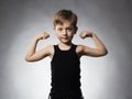 Child. Funny Little Boy.Sport Handsome Boy showing his hand biceps muscles Royalty Free Stock Photo