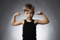 Child. Funny Little Boy.Sport Handsome Boy showing his hand biceps muscles Royalty Free Stock Photo