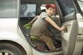 The child gets out of the car. The boy got into the vehicle