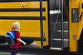Child getting on a school bus Royalty Free Stock Photo