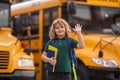 Child getting on the school bus. American School. Back to school. Bye bye. Kid of primary school. Happy children ready Royalty Free Stock Photo