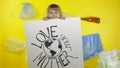 Girl activist holding poster Love Your Mother Earth. Plastic nature pollution