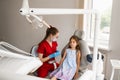 Child girl afraid dentist. Childrens dentist consults frightened kid in dentistry. Treatment of teeth and toothache in