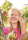 Child (girl) with apples.